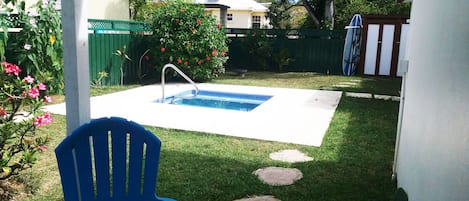 View from private patio to shared tropical garden and small plunge pool.