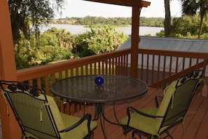 Relax on covered deck w/ view of lake. Enjoy coffee sunrises & cocktail sunsets!