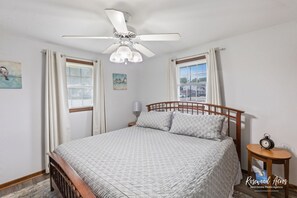 King Bed in Master bedroom with a 55"Smart TV