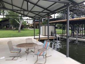 Boat dock looking toward lake house.  Swim area on right.