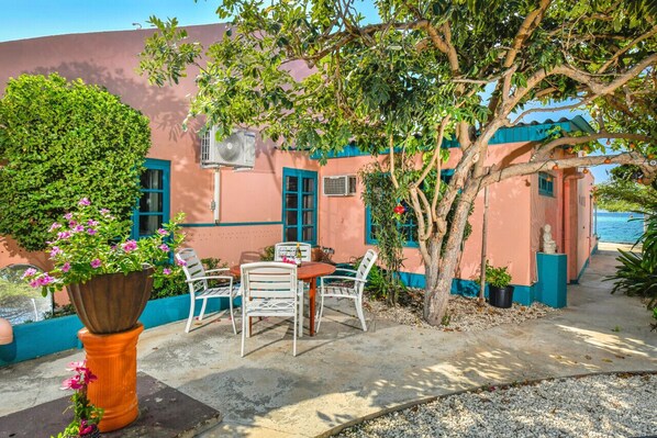 A cozy sitting area right next to your unit, perfect for relaxing with a drink or a bite to eat. Just steps away from the beach.