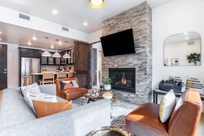 The perfect place for movie nights with a fireplace and TV.
