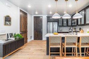 Modern kitchen with barstool seating.