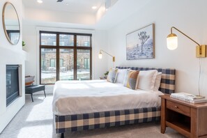 Primary bedroom features a king bed, ensuite bathroom, and fireplace.