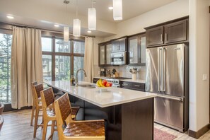 Spacious kitchen with additional seating.