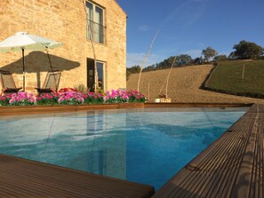 Pool with teak decking and access directly from the terrazzo