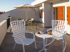 Spacious terrace with sitting area and sea view