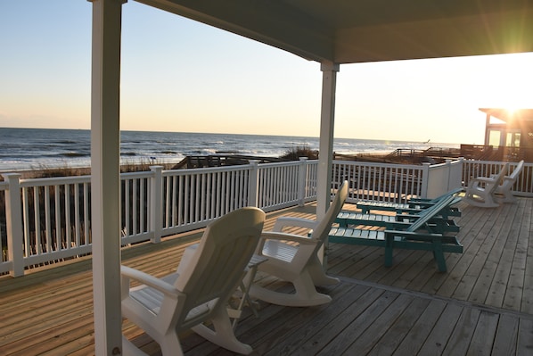 Deck overlooking and just steps from beach and ocean