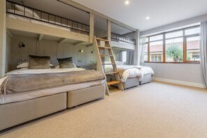 The Owl House, Little Massingham: 'The Dorm' with built-in bunk complex which can either be taken with two super king beds and two single top bunks, or as six single beds