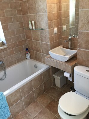 Bathroom with separate shower cubicle which is behind the photo taker!