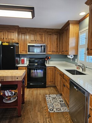 Newly renovated kitchen with quartz. Kitchen is stocked with unlimited supplies