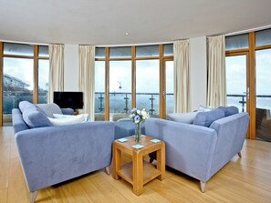 Living area with large windows | Pebbles, Westward Ho!