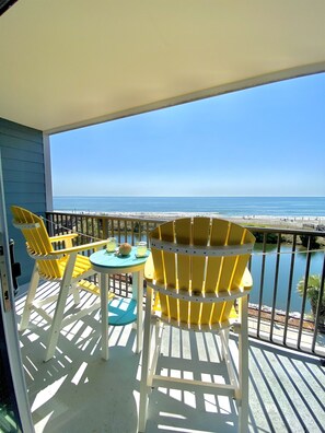 Amazing oceanfront and pond views from your private oceanfront balcony!  With new polywood furniture to relax and take in the views!  We often see dolphins swimming, pelicans surfing the waves, turtles sunbathing & many different birds fishing in the pond!