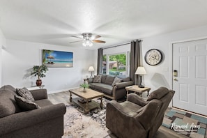 65' smart tv in spaciou living room