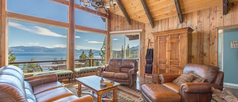Family Room with panoramic lake views,  wood burning fire place, access to deck