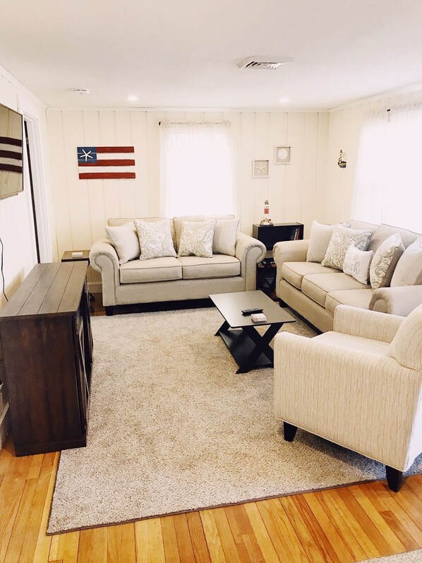 Living room with plenty of storage, seating and flat screen tv