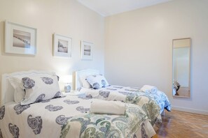 In the second bedroom, you will find two individual beds to have a great night of sleep.