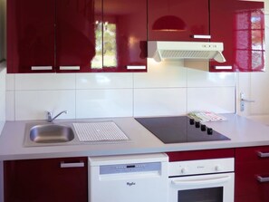 Countertop, Kitchen, Room, Cabinetry, Property, Furniture, Interior Design, Tile, Kitchen Stove, Sink