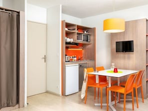 Orange, Room, Furniture, Property, Interior Design, Yellow, Building, Table, Floor, Cupboard