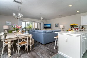 Open Floor Plan with Rays of Sunshine throughout Living Area, Dining Room and Kitchen