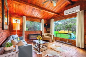 Cozy up by the fireplace in the living room