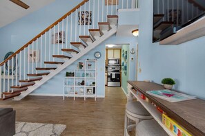 This room features modern design with practical furniture creating an open and airy feel.