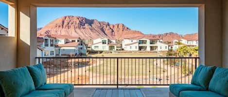 Insanely beautiful views of the Red Mountain from the balcony of this home (see next photo to view amenity area that now occupies the lawn space)