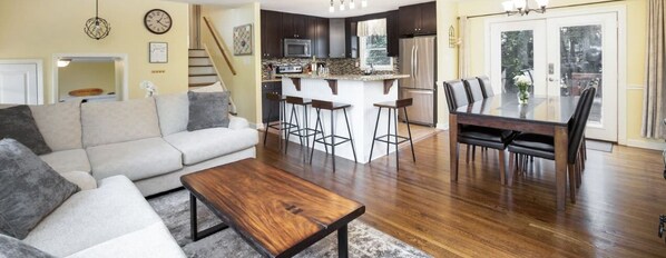 Large great room features a large flat screen tv (not pictured) and plenty of seating for everyone! Use QR Code to enjoy Virtual Tour of whole house!