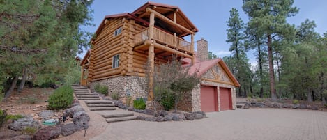 3 story large timber logs, master bedroom balcony, steps to front door