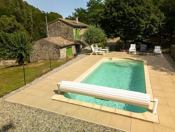Water, Building, Plant, Swimming Pool, Tree, Outdoor Furniture, Sky, Rectangle, Shade, Wood
