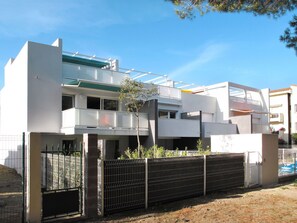 Sky, Daytime, Plant, Building, Urban Design, Cloud, Land Lot, Window, Fence, Tree