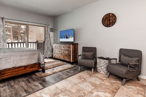 Queen bed, 2 chairs, TV cabinet - perfect for unwinding.