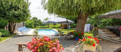 Hot tub and a heated pool with vineyard views