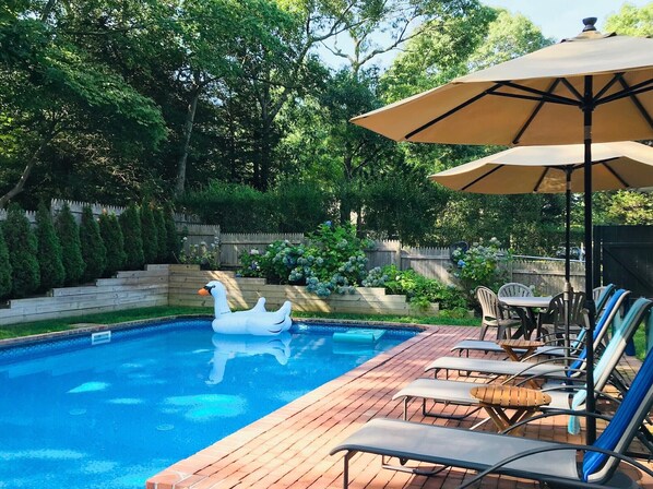 Fenced-in heated pool. Four foot depth/vinyl-lined. 