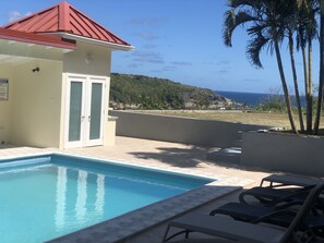 Outdoor pool with ocean view perfect for your enjoyment and relaxation.