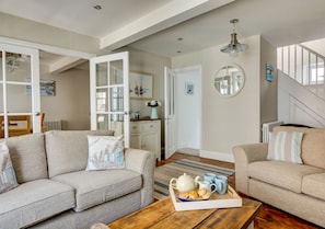Lounge with stairs to bedrooms