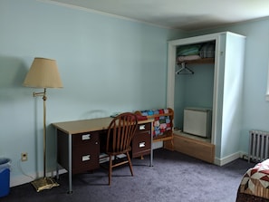 Desk and closet with cube refrigerator for late-night study snacks