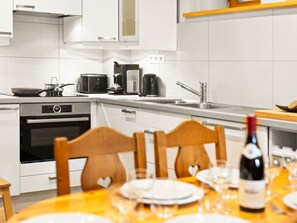 Cabinetry, Property, Countertop, Table, Kitchen Appliance, Kitchen Stove, Kitchen, Interior Design, Kitchen Sink, Floor