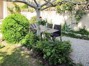 Plant, Table, Leaf, Tree, Vegetation, Chair, Outdoor Furniture, Outdoor Table, Shade, Building