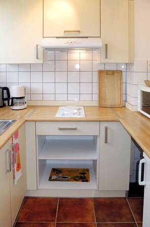Cabinetry, Kitchen Sink, Countertop, Sink, Kitchen Stove, Kitchen, Wood, Interior Design, Floor, Flooring