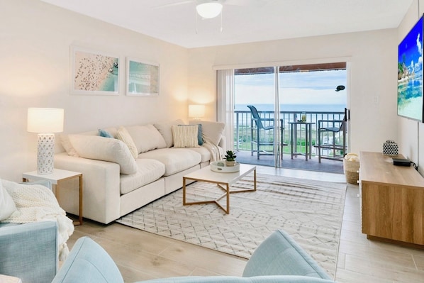 Bright and beachy living room with a view!