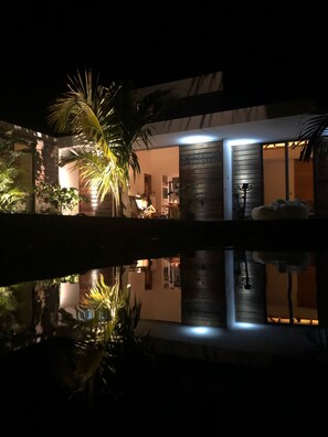 Pool and house at night