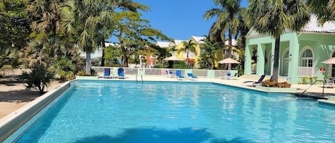 Located in Little Bay Country Club
Step unto a private beach . Steps to the pool