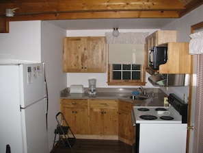 Newly updated kitchen, There is a full size stove and fridge, plus a microwave  