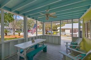 The spacious covered porch is the perfect place to spend time outdoors with friends and family!