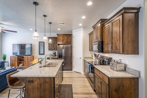 Kitchen Side View - This sleek, modern kitchen has all the best upgrades to make cooking a breeze!
