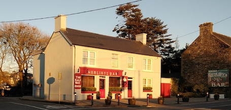 Exterior with parking area to rear