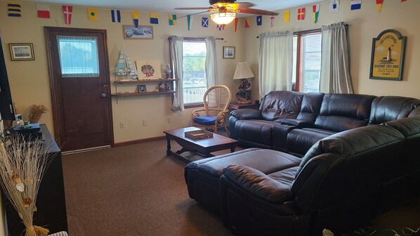 Living Room - Large leather sectional & 70" cable TV. Private deck on side