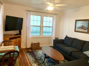 Living room with sectional and game table