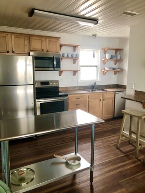 Kitchen with eat in bar- barely in picture to the right.